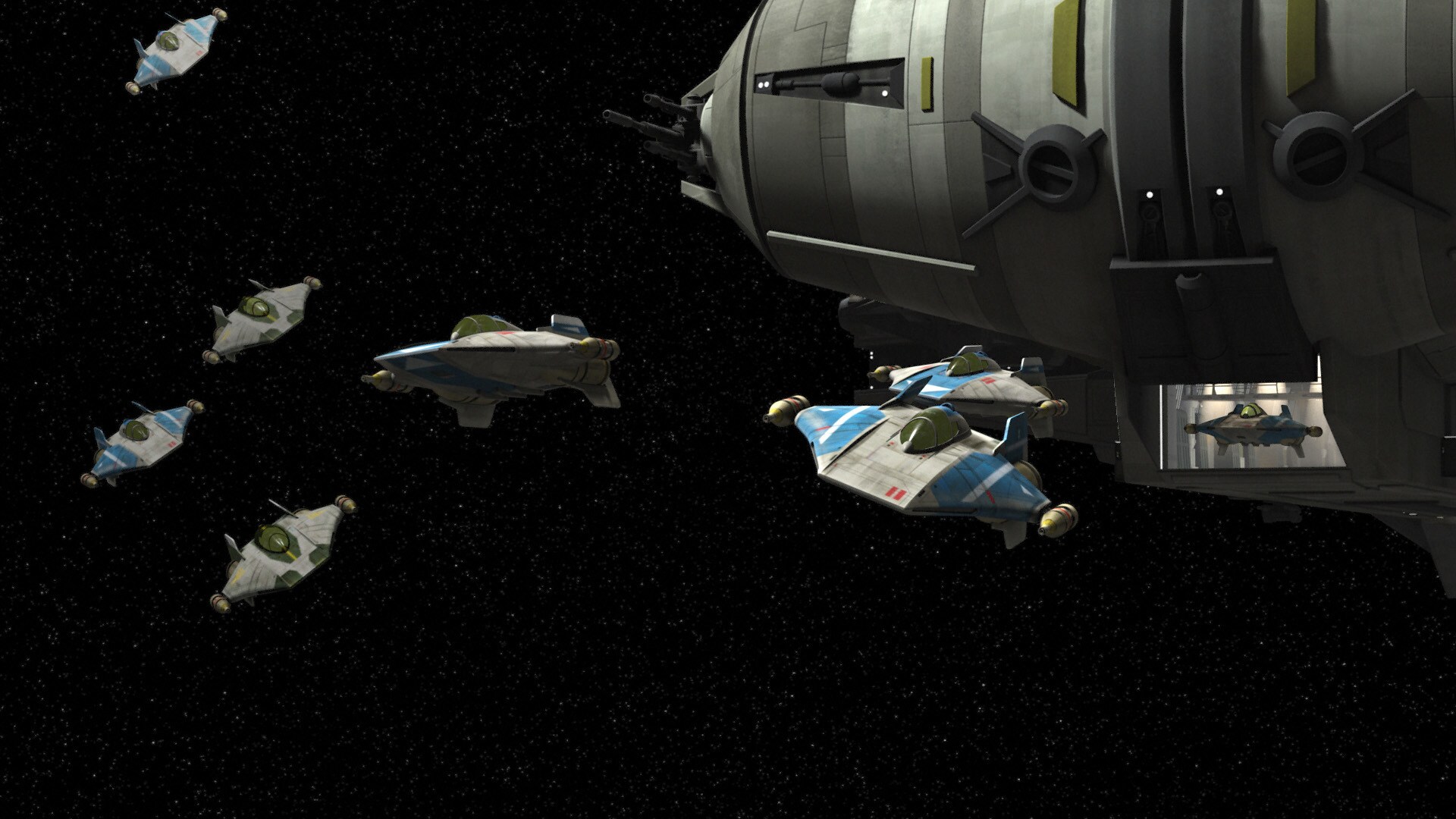 With docking tubes extended, a blockade runner can carry three A-wing fighters. 