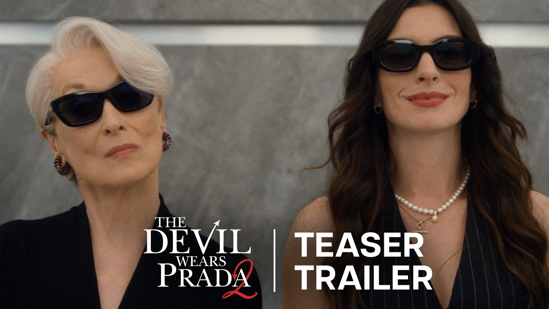 Image of Miranda Priestly (actor Meryl Streep) and Andy Sachs (actor Anne Hathaway) standing side by side, both wearing sunglasses, from the 20th Century Studios movie, "The Devil Wears Prada 2."