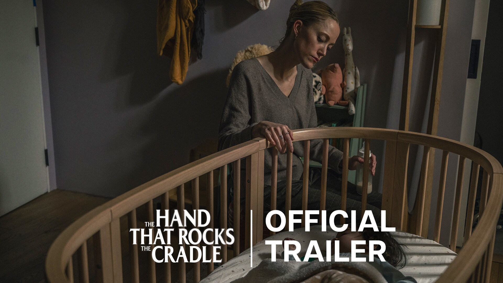 Image of a woman looking in on a cradle | The Hand That Rocks the Cradle | Official trailer