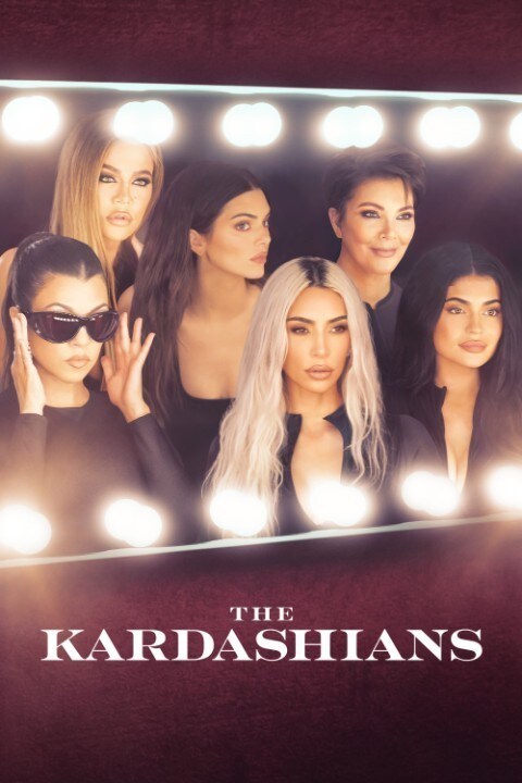The famous reality TV stars, The Kardashian family sit and stand next to each other.