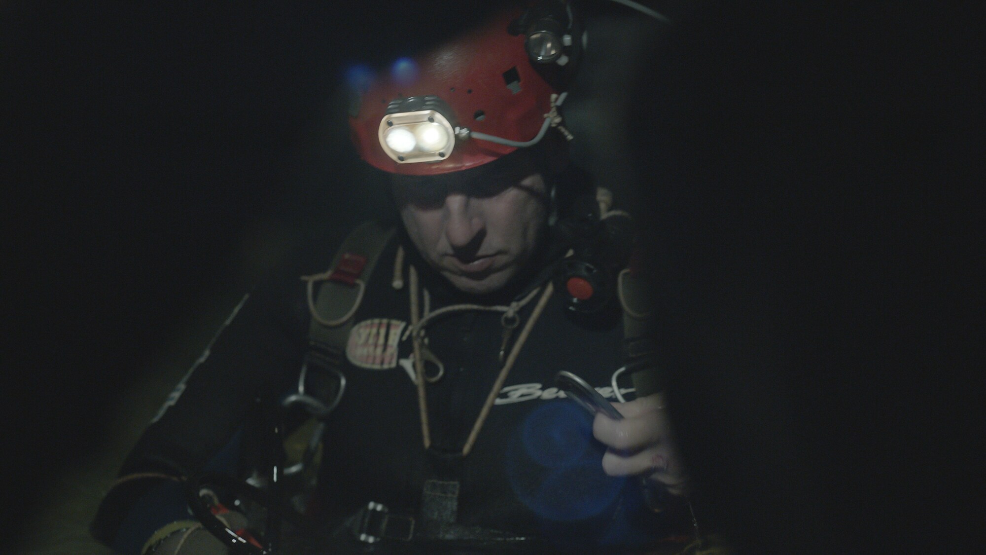 Cave diver, Rick Stanton, preps for dive.  THE RESCUE chronicles the 2018 rescue of 12 Thai boys and their soccer coach, trapped deep inside a flooded cave. E. Chai Vasarhelyi and Jimmy Chin reveal the perilous world of cave diving, bravery of the rescuers, and dedication of a community that made great sacrifices to save these young boys. (Credit: National Geographic)