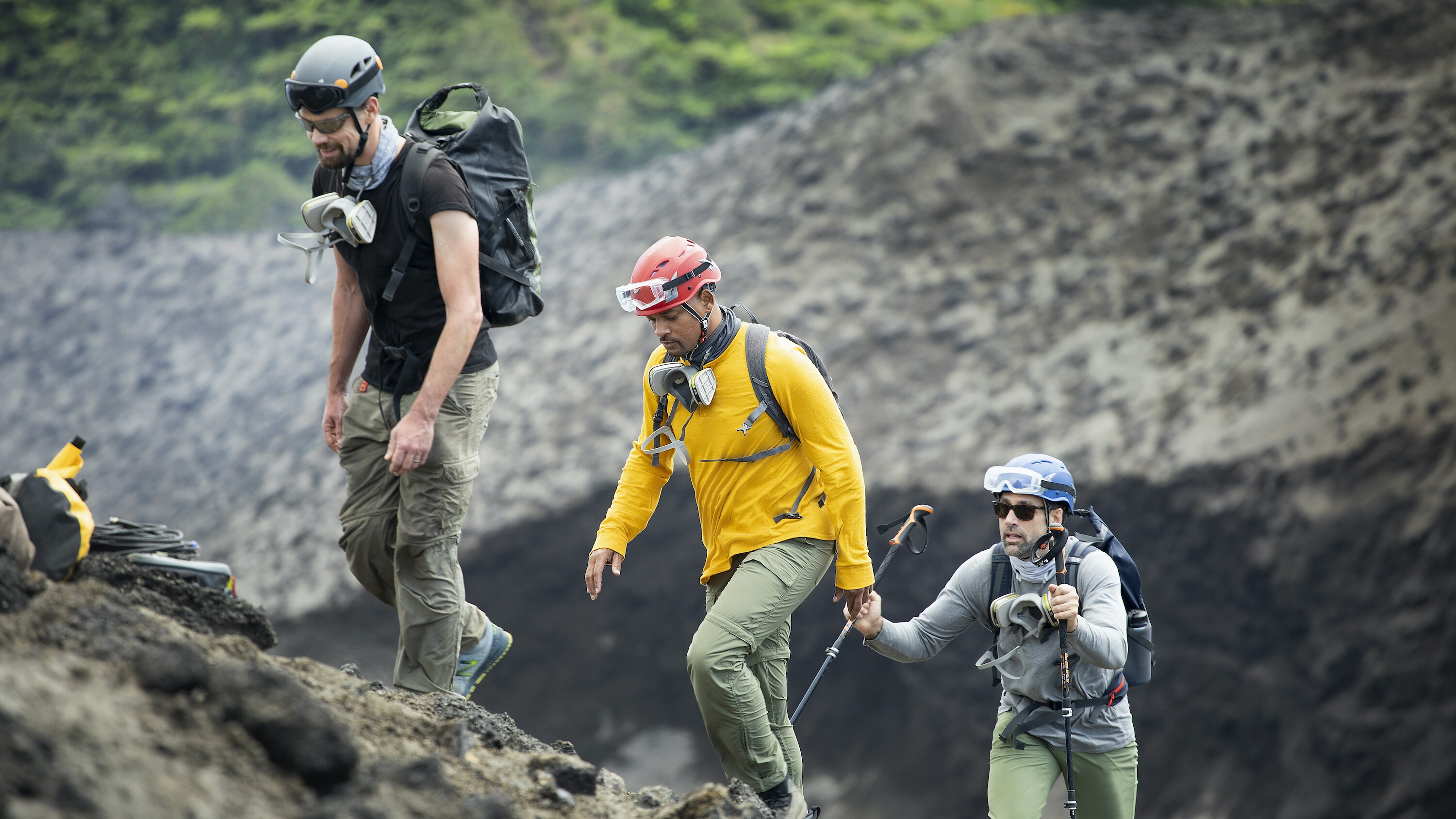 (L to R): Vulcanologist Jeff Johnson, Will Smith and Explorer Erik Weihenmayer prepare to descend into a volcano to install sensors. (National Geographic for Disney+/Kyle Christy)