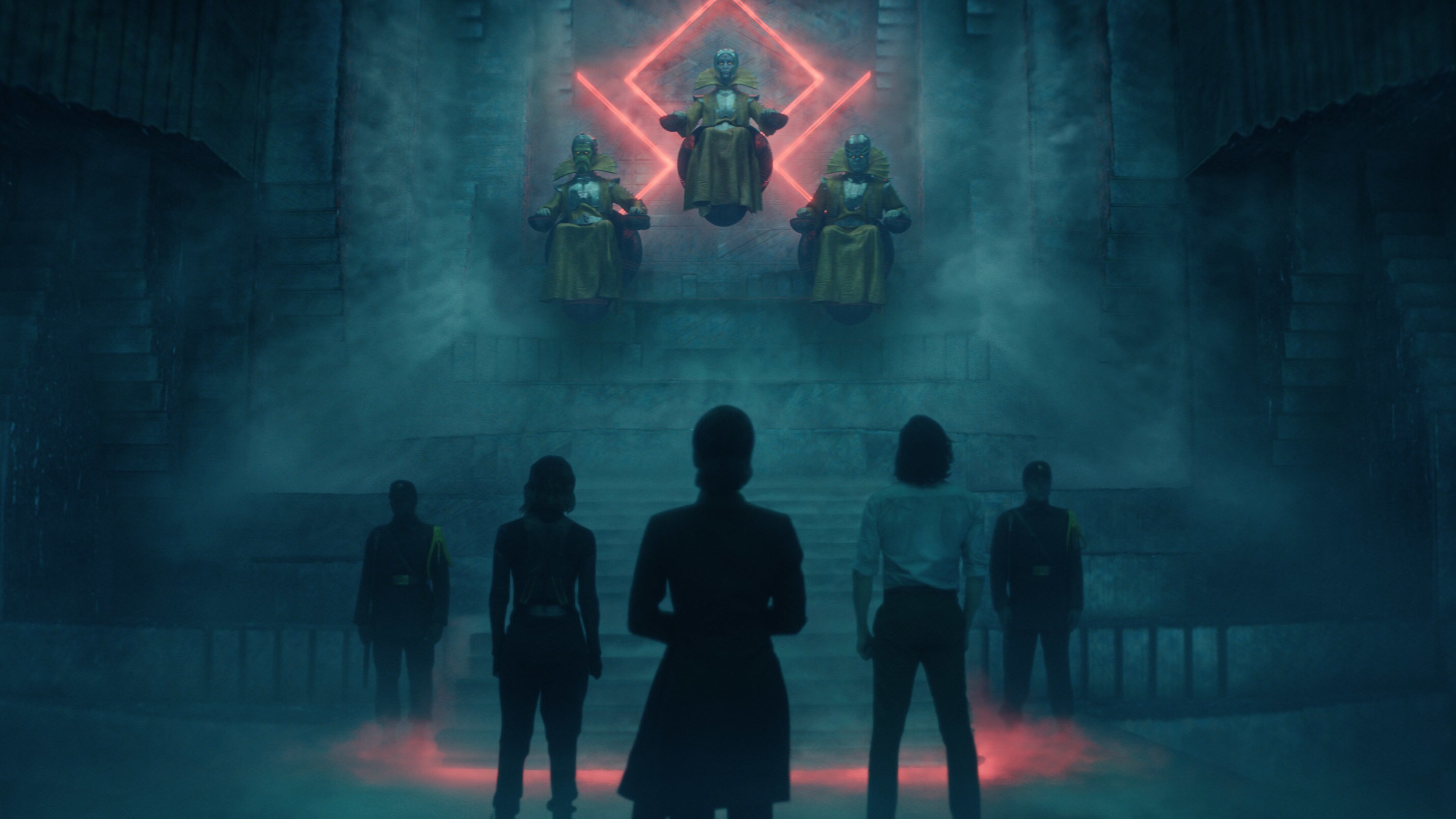 (Top): The Timekeepers, (bottom center, l-r): Sylvie (Sophia Di Martino), Judge Renslayer (Gugu Mbatha-Raw) and Loki (Tom Hiddleston) in Marvel Studios' LOKI, exclusively on Disney+. Photo courtesy of Marvel Studios. ©Marvel Studios 2021. All Rights Reserved.