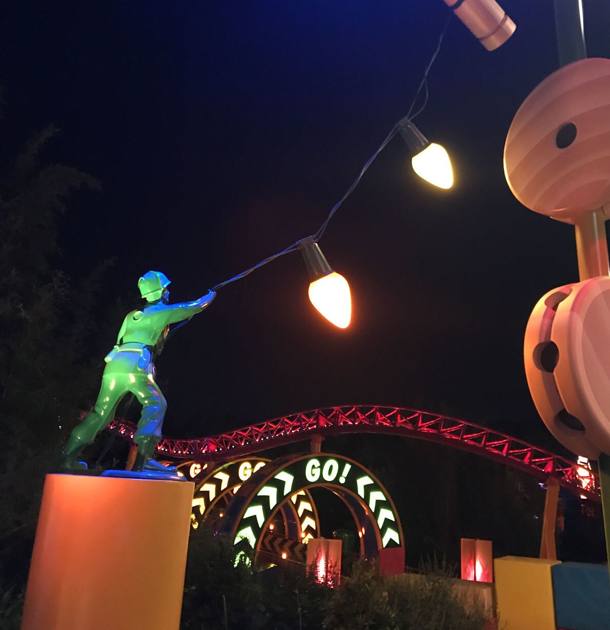 Toy Story Land at Night with Slinky Dog Dash, Lights, and Green Army Man at Walt Disney World