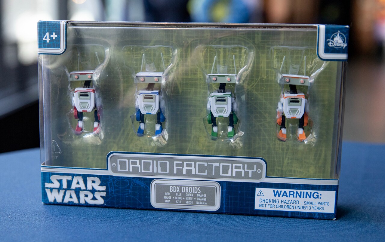 Droid Factory product packaging, revealing 4 multicolored droids within
