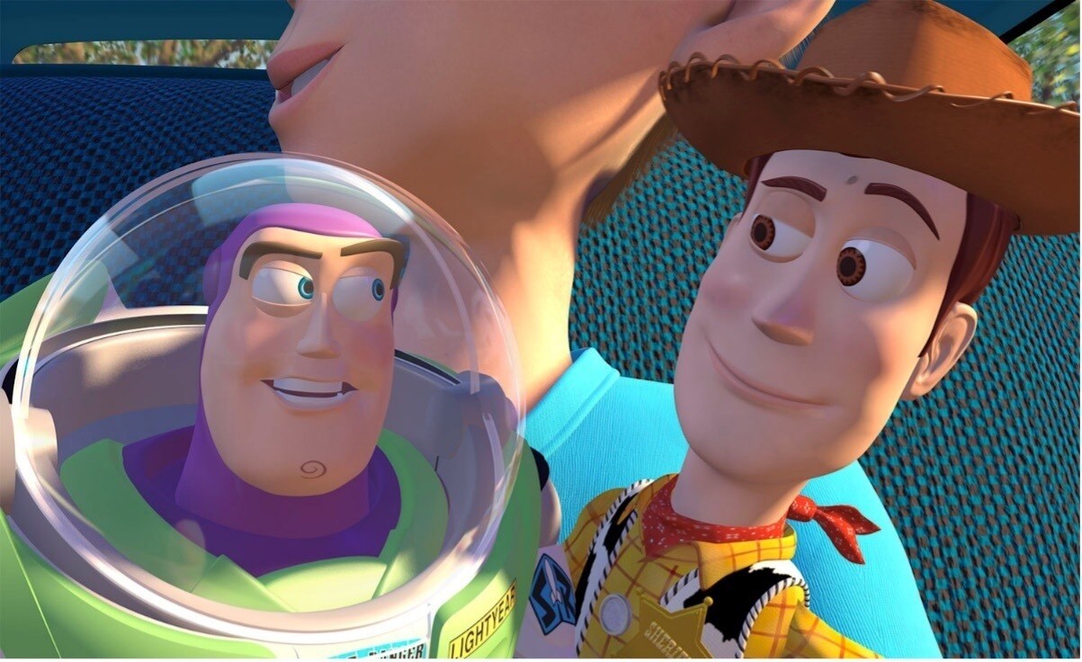 Woody and Buzz smile at each other in Toy Story