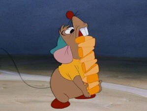 Gus Gus walking with a stack of corn in the animated movie "Cinderella"