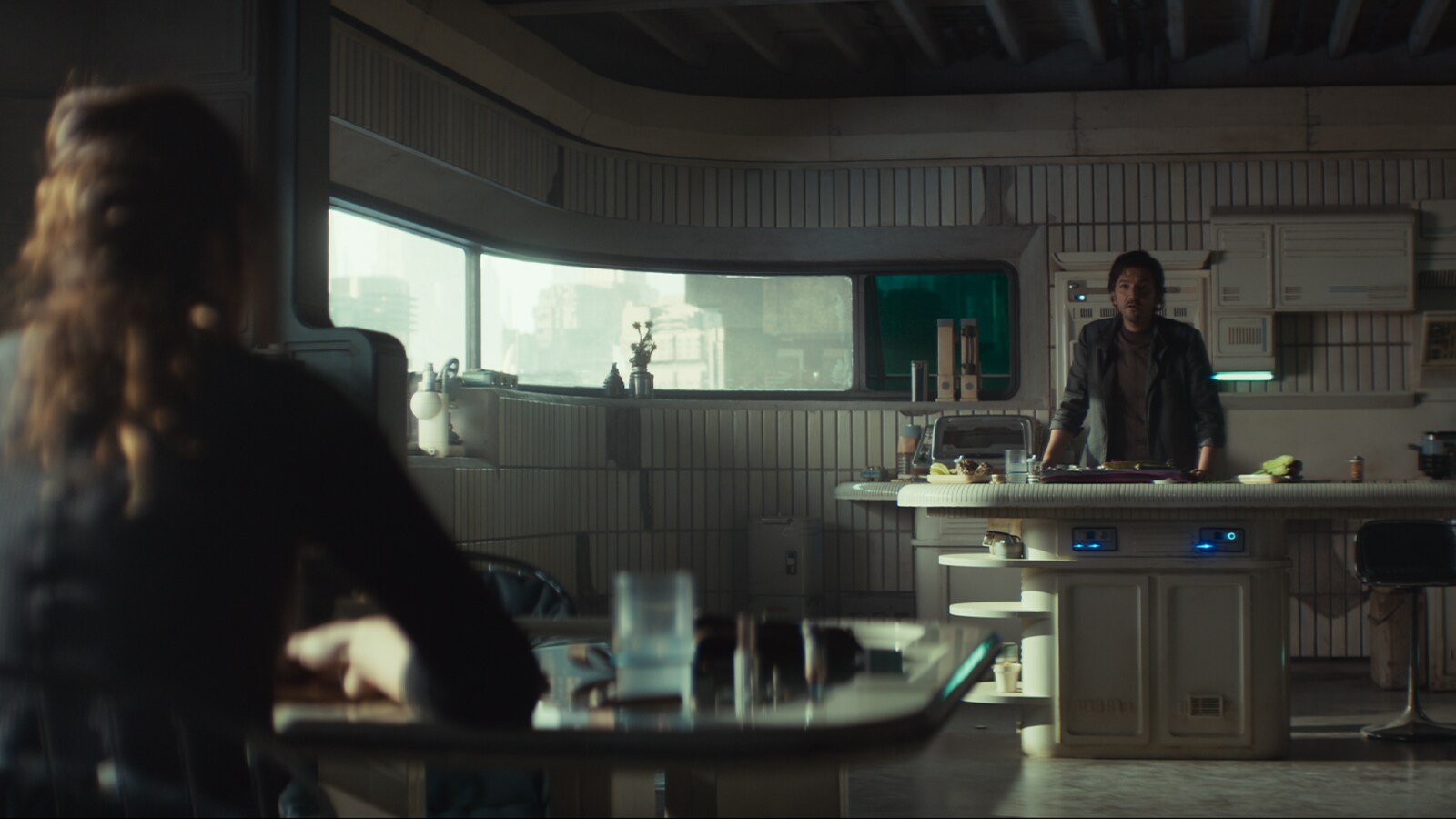 Bix and Cassian in the Axis network safehouse.