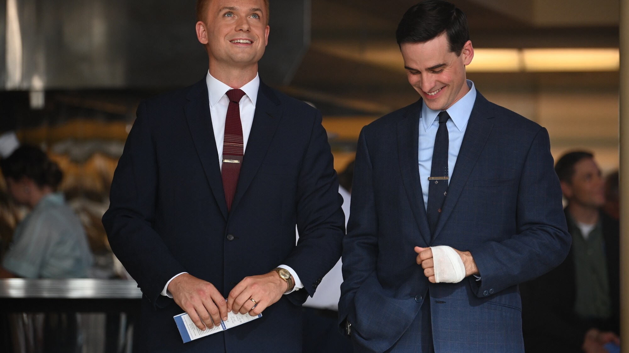 L to R: John Glenn played by Patrick J. Adams and Gordon Cooper played by Colin O’Donoghue talk after a strenuous week of medical and psychological evaluations for Project Mercury in National Geographic's THE RIGHT STUFF streaming on Disney+. (Credit: Nati