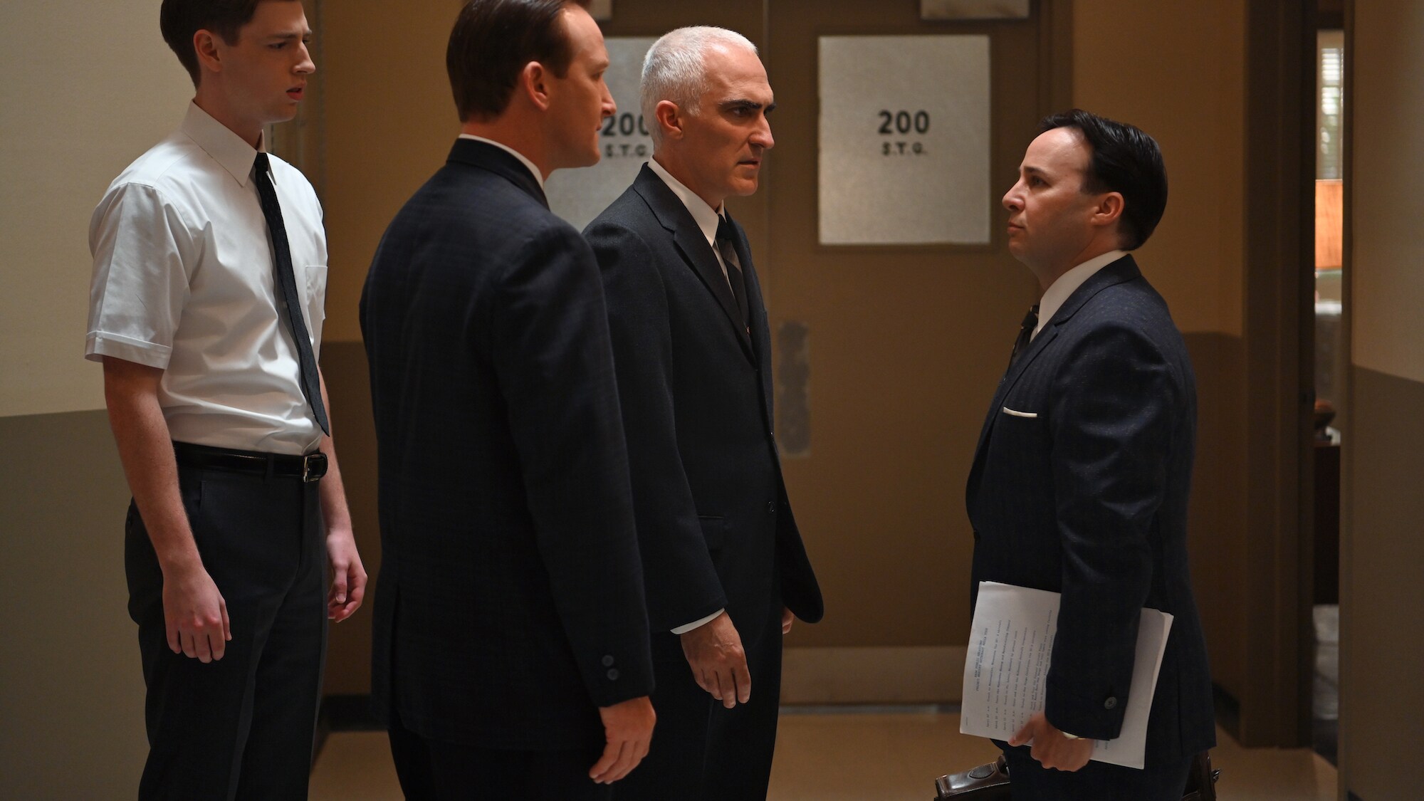 L to R: Glynn Lunney played by Jackson Pace, Chris Kraft played by Eric Ladin, Bob Gilruth played by Patrick Fischler and John "Shorty" Powers played by Danny Strong in National Geographic's THE RIGHT STUFF streaming on Disney+. (National Geographic/Gene P