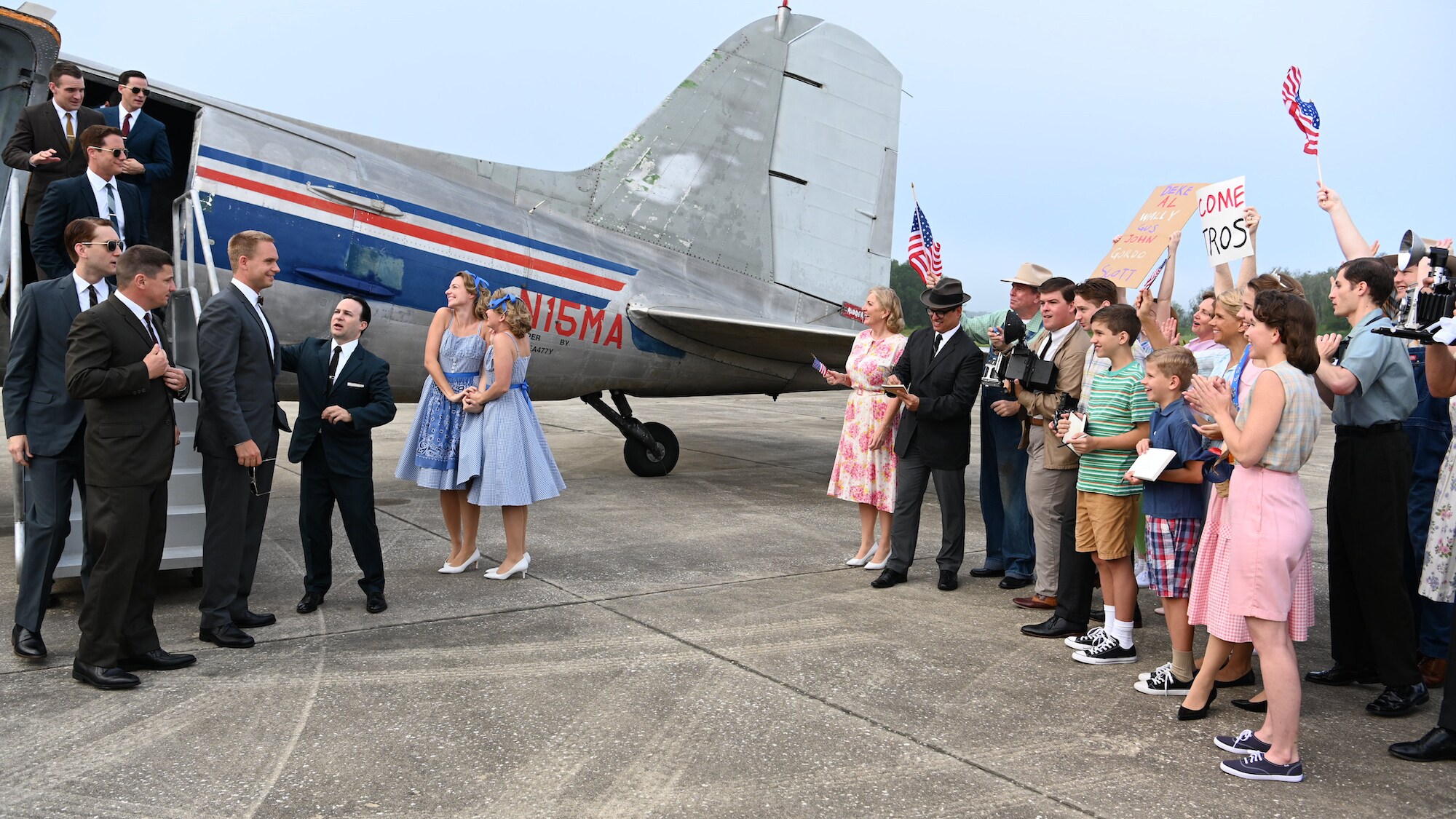 John "Shorty" Powers played by Danny Strong with the Mercury astronauts as they greet a crowd and press in an effort to win the hearts and minds of Americans in National Geographic's THE RIGHT STUFF streaming on Disney+. (National Geographic/Gene Page)