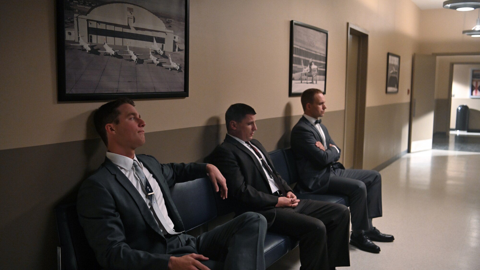 L to R: Jake McDorman as Alan Shepard, Michael Trotter as Gus Grissom and Patrick J. Adams as John Glenn waiting to address the press in National Geographic's THE RIGHT STUFF streaming on Disney+. (National Geographic/Gene Page)