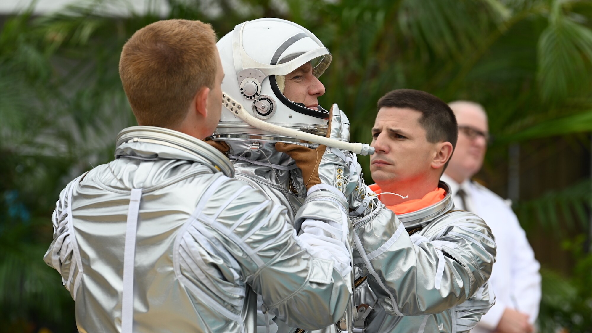 L to R: Patrick J. Adams as John Glenn, Jake McDorman as Alan Shepard and Michael Trotter as Gus Grissom during an emergency procedure demonstration in a swimming pool for Dr. Jerome Wiesner and other members of the President’s Science Advisory Committee (not pictured) in National Geographic's THE RIGHT STUFF streaming on Disney+. (Credit: National Geographic/Gene Page)