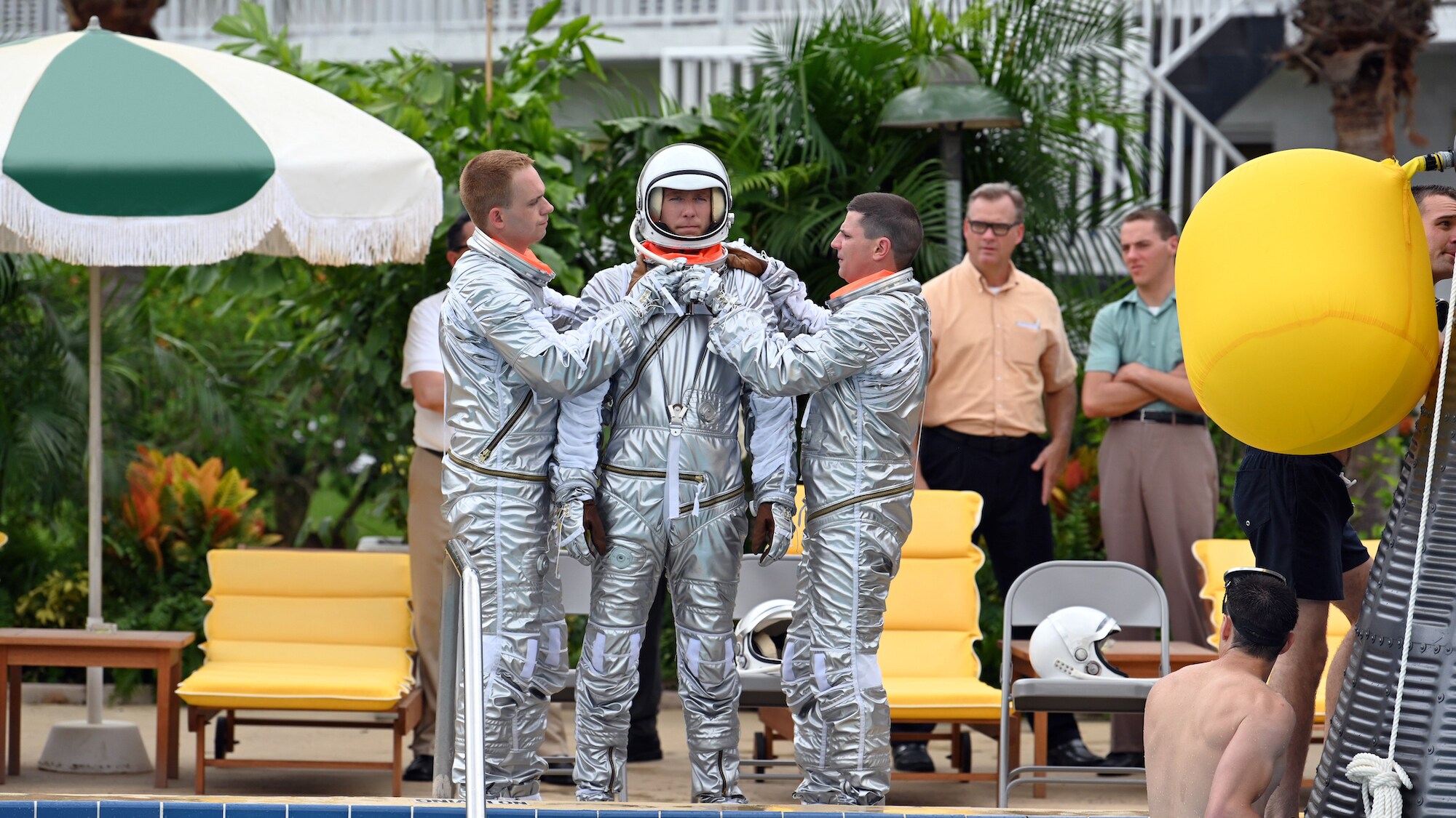 Center L to R: Patrick J. Adams as John Glenn, Jake McDorman as Alan Shepard and Michael Trotter as Gus Grissom during an emergency procedure demonstration in a swimming pool for Dr. Jerome Wiesner and other members of the President’s Science Advisory Committee (not pictured) in National Geographic's THE RIGHT STUFF streaming on Disney+. (Credit: National Geographic/Gene Page)