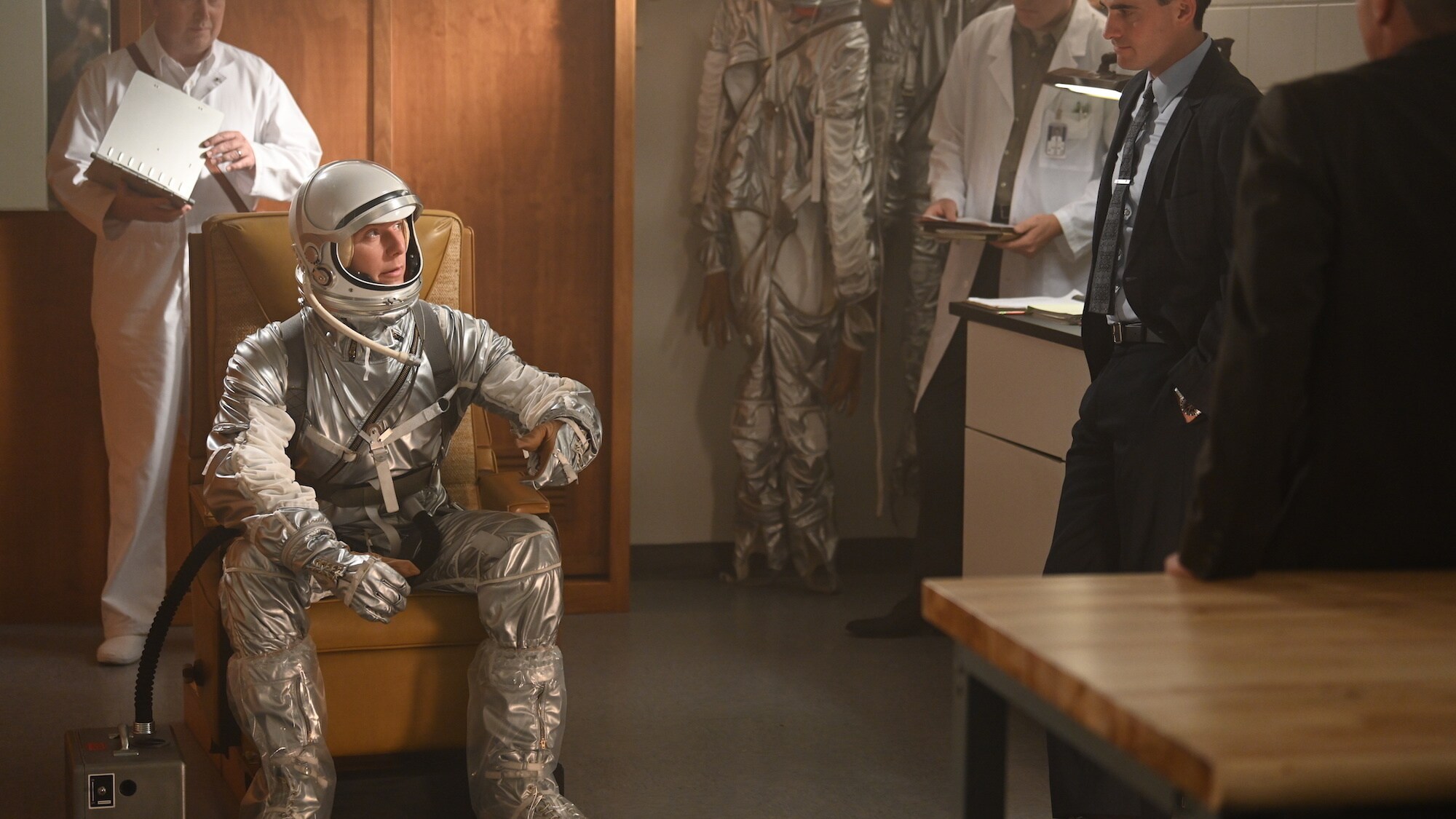 Jake McDorman as Alan Shepard (seated) talking to Colin O’Donoghue as Gordon Cooper (R) in National Geographic's THE RIGHT STUFF streaming on Disney+. (Credit: National Geographic/Gene Page)