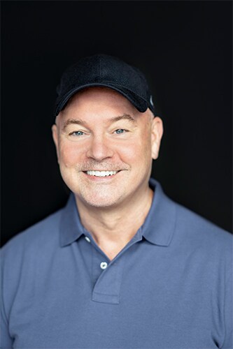 Headshot of Matt West smiling at the camera.