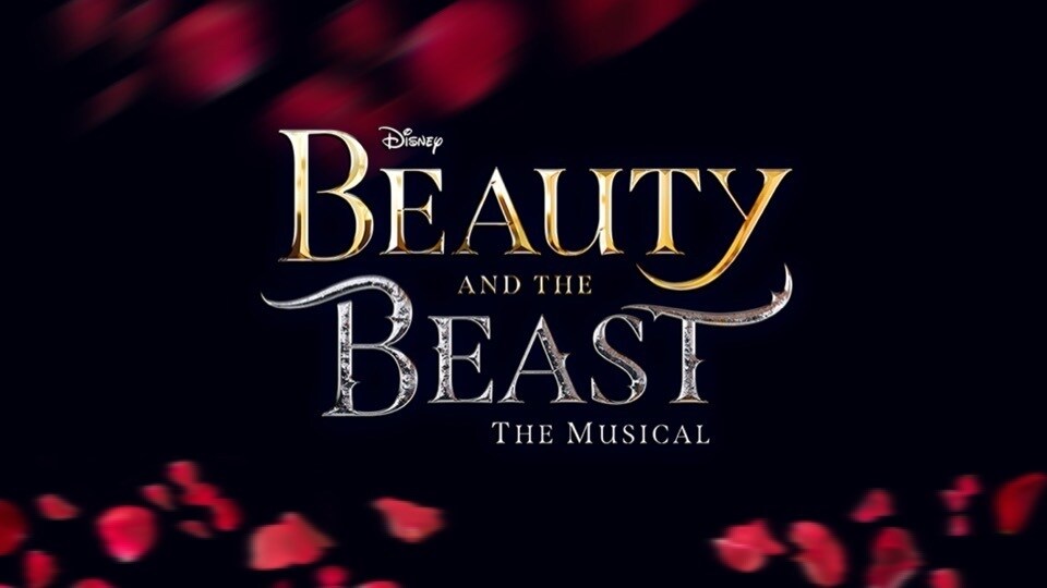 Beauty and the Beast the Musical written on a dark background with rose petal decorations