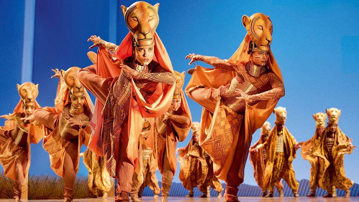 Actors posing as lionesses in the stage show The Lion King 