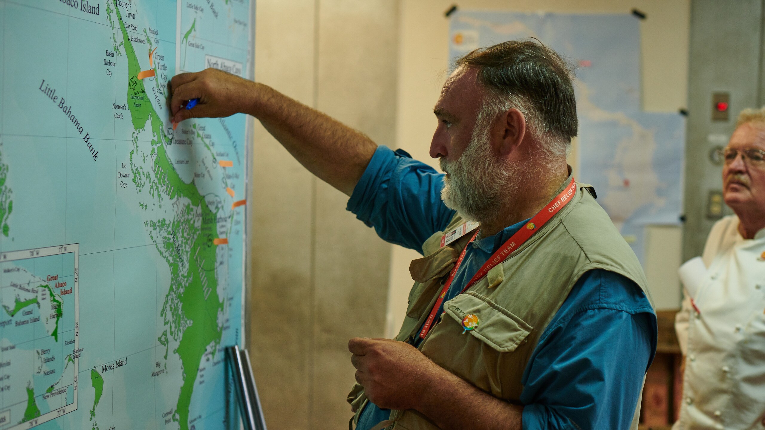 José Andrés uses arrows to denote where World Central Kitchen distribution points are on a map of Great Abaco Island in the Bahamas. (Credit: National Geographic/Emily Caldwell)