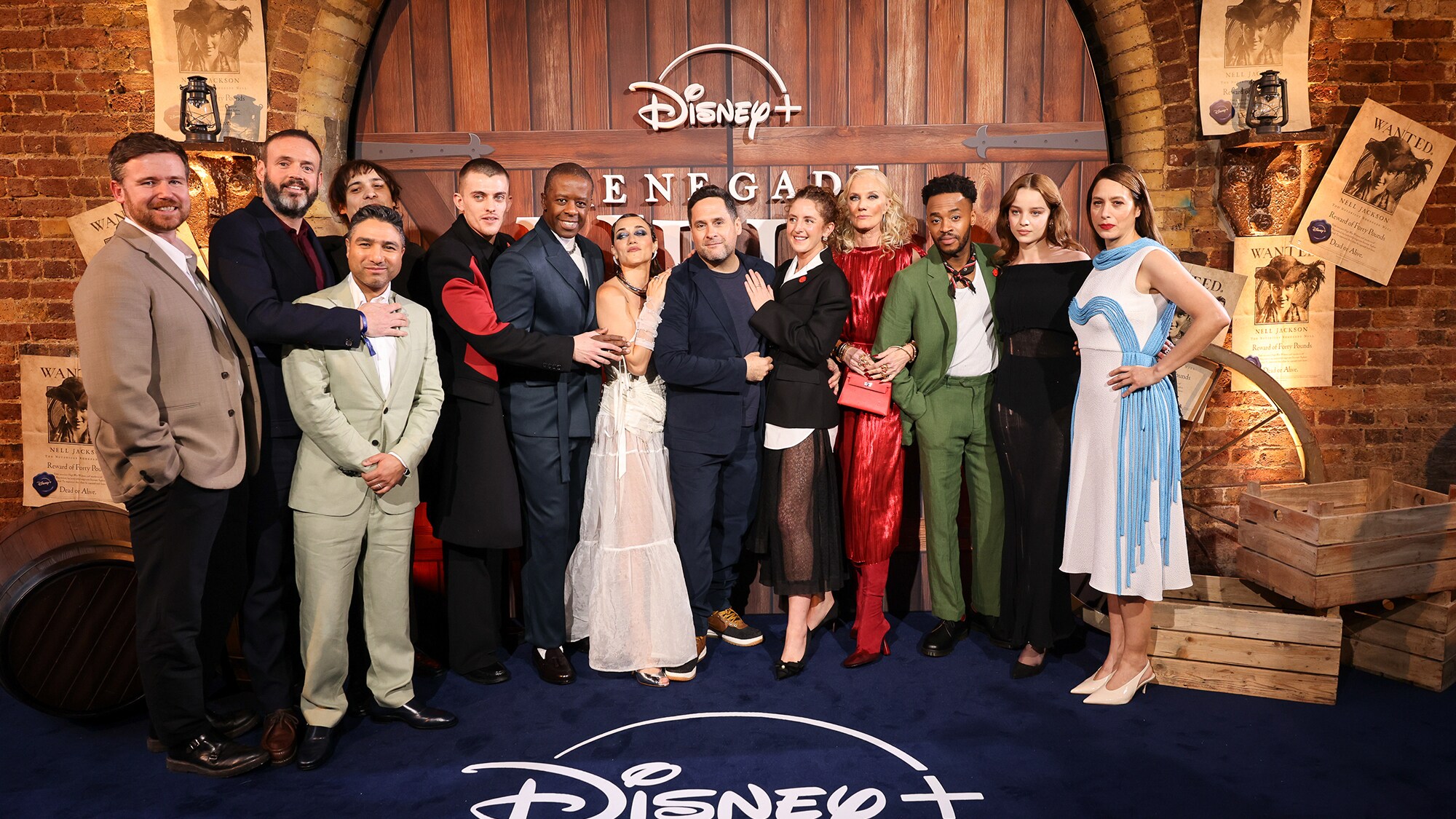 LONDON, ENGLAND - MARCH 26: (L to R) Executive Producer Will Johnston, guest, Frank Dillane, Nick Mohammed, Jake Dunn, Adrian Lester, Alice Kremelberg, Ben Taylor, Louisa Harland, Joely Richardson, Enyi Okoronkwo, Bo Bragason and Jodhi May attend the World Premiere of "Renegade Nell" on March 26, 2024 in London, England. The UK Original series is coming to Disney+ from Friday 29th March. (Photo by Max Cisotti/Dave Benett)