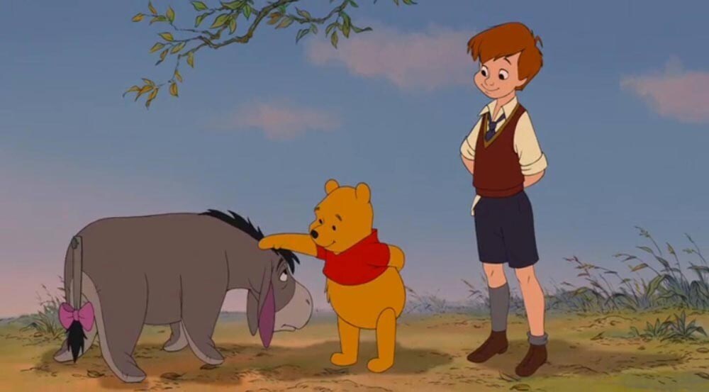 Christopher Robin watching Winnie Pooh pat Eeyore on the head