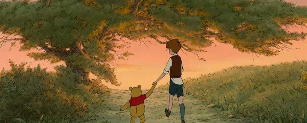 Winnie the Pooh and Christopher Robin walking while holding hands