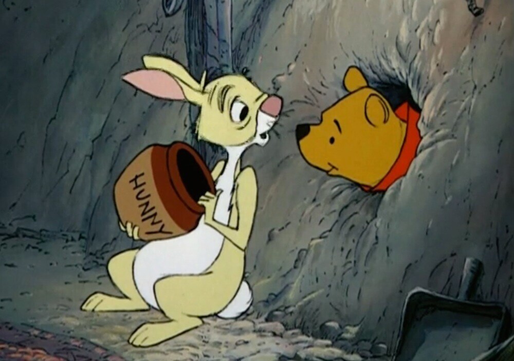 Rabbit holding an empty jar of "Hunny" and Winnie the Pooh poking his head through a hole to see it