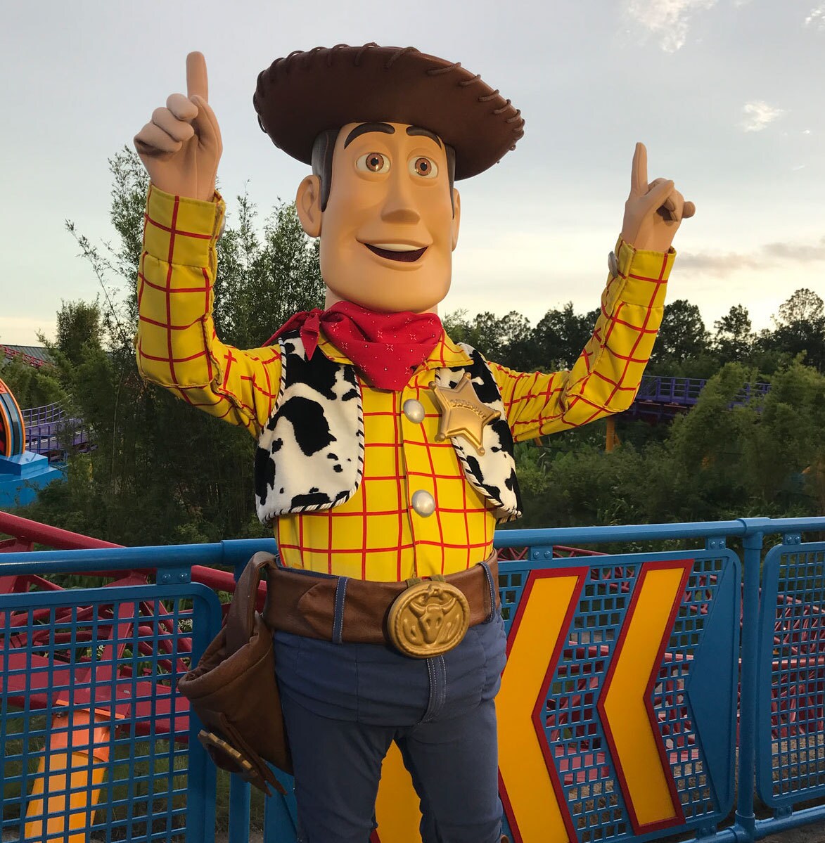 Woody pointing to the sky in Toy Story Land in Walt Disney World
