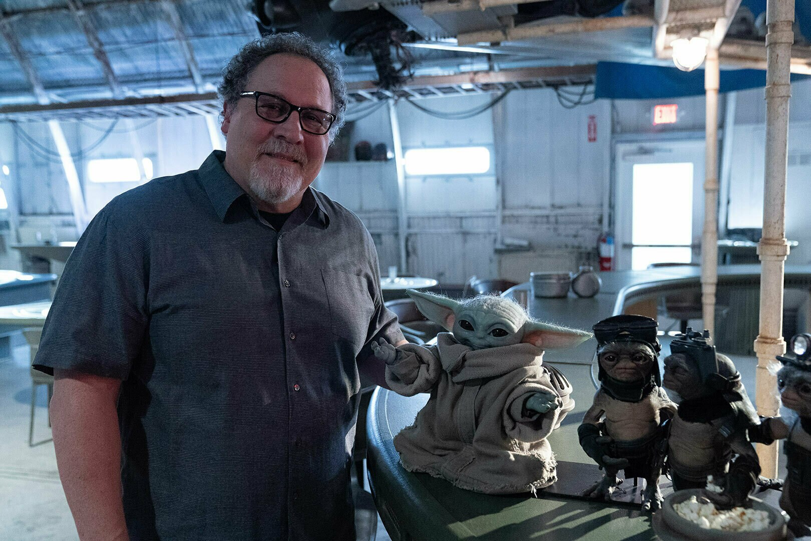 Jon Favreau with Grogu on the set of Star Wars: The Mandalorian and Grogu.