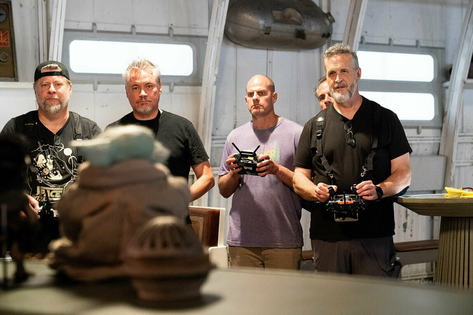 The puppeteers of Grogu and the Anzellan puppets on the set of Star Wars: The Mandalorian and Grogu.